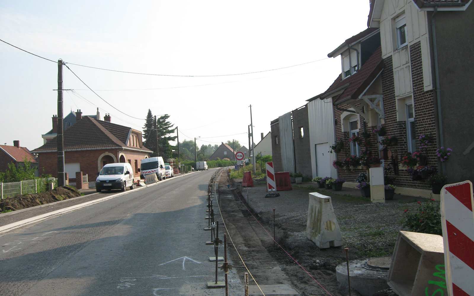 travaux pose de bordure aménagement paysager rue de robecq